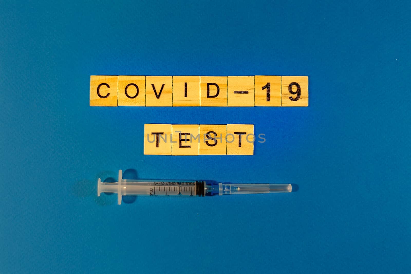 Virus Test of Coronavirus. Prevent or stop the spread of the COVID-19 worldwide. Letters test on blue background. by Pirlik