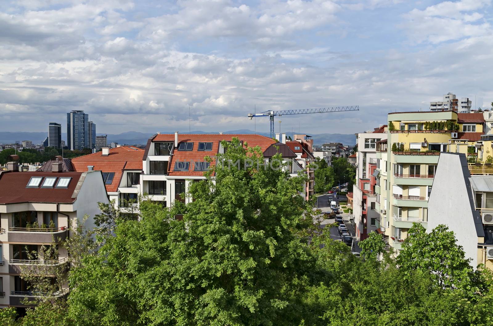 Residential neighborhood with new modern houses against the backdrop of a cityscape in the Bulgarian capital Sofia, Bulgaria
