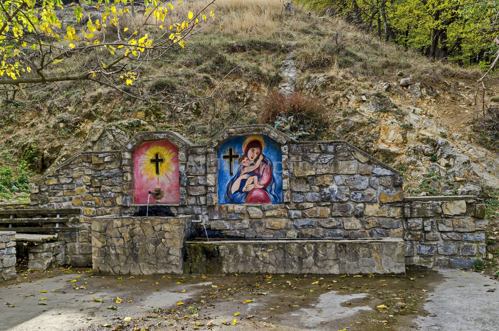 Fresh water gush from  fountain built from Christians  in the Balkan mountain near town Maglizh, Bulgaria