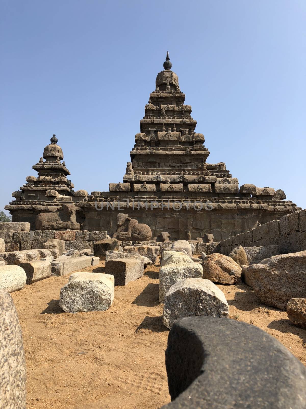 Shore temple is the structural building built with the block of granite at 8th Century AD. It is one of the Group of Monuments at Mahabalipuram and it has been classified as a UNESCO World Heritage Site. Shore temple is the oldest structural rock-cut stone temples of South India and contains complex of temples and shrines. This temple complex is initiated by King  Narasimhavarman II and it is called one of the Seven Pagodas in ancient times.