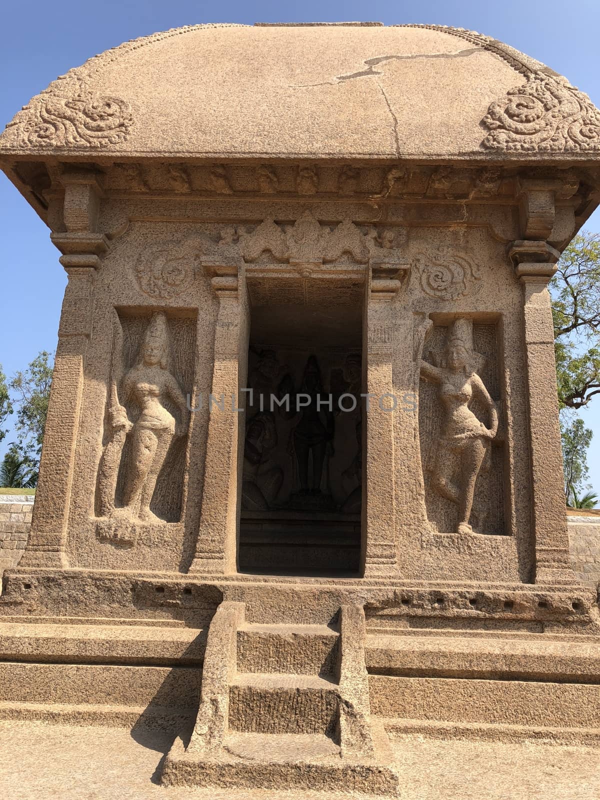 Draupadi Ratha is a monument in the Pancha Rathas is an example of monolith Indian rock-cut architecture. Resembling a chariot ratha, it is carved out of a single, long stone of pink granite. This is one of the Group of Monuments at Mahabalipuram and also a UNESCO World Heritage Site. The unfinished structure is dedicated to the goddess Durga.