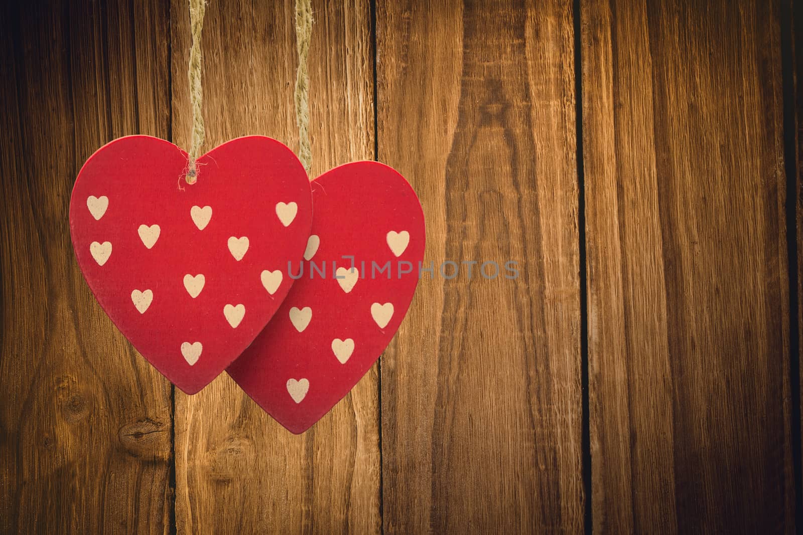 Cute heart decorations against wooden table