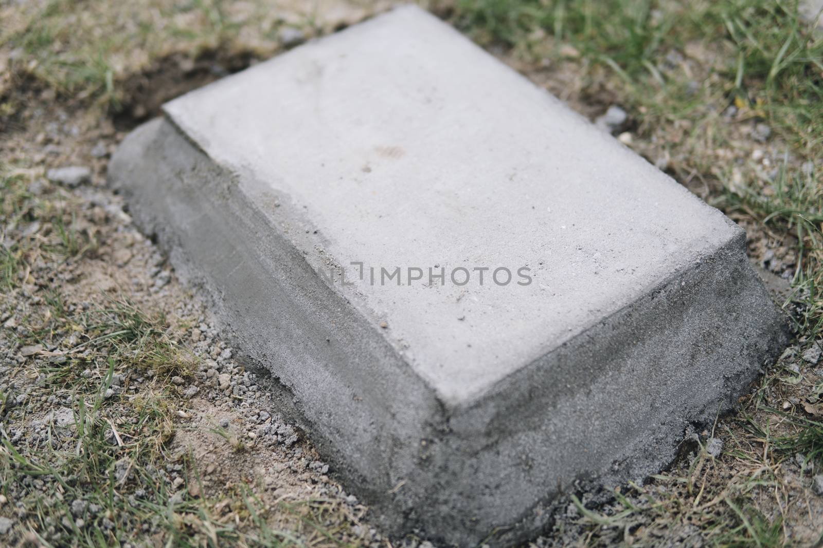 concrete block embeded on a ground by michal812