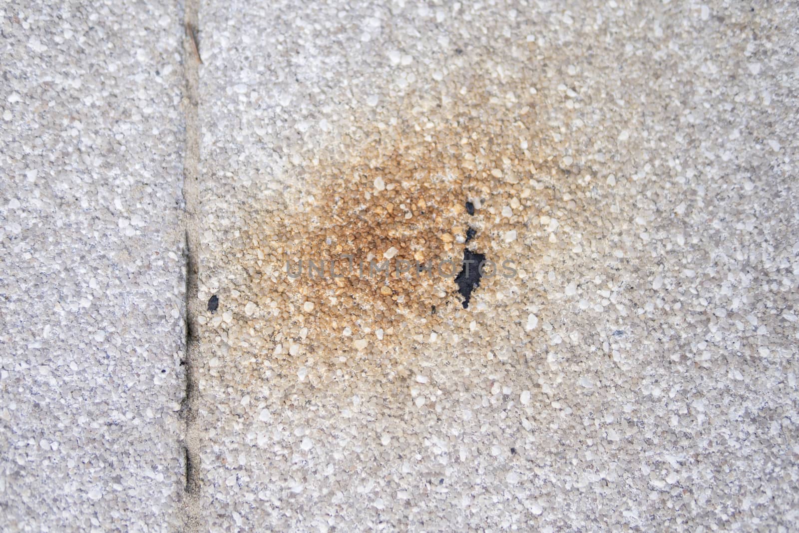  rusty spot on a concrete pavement by michal812