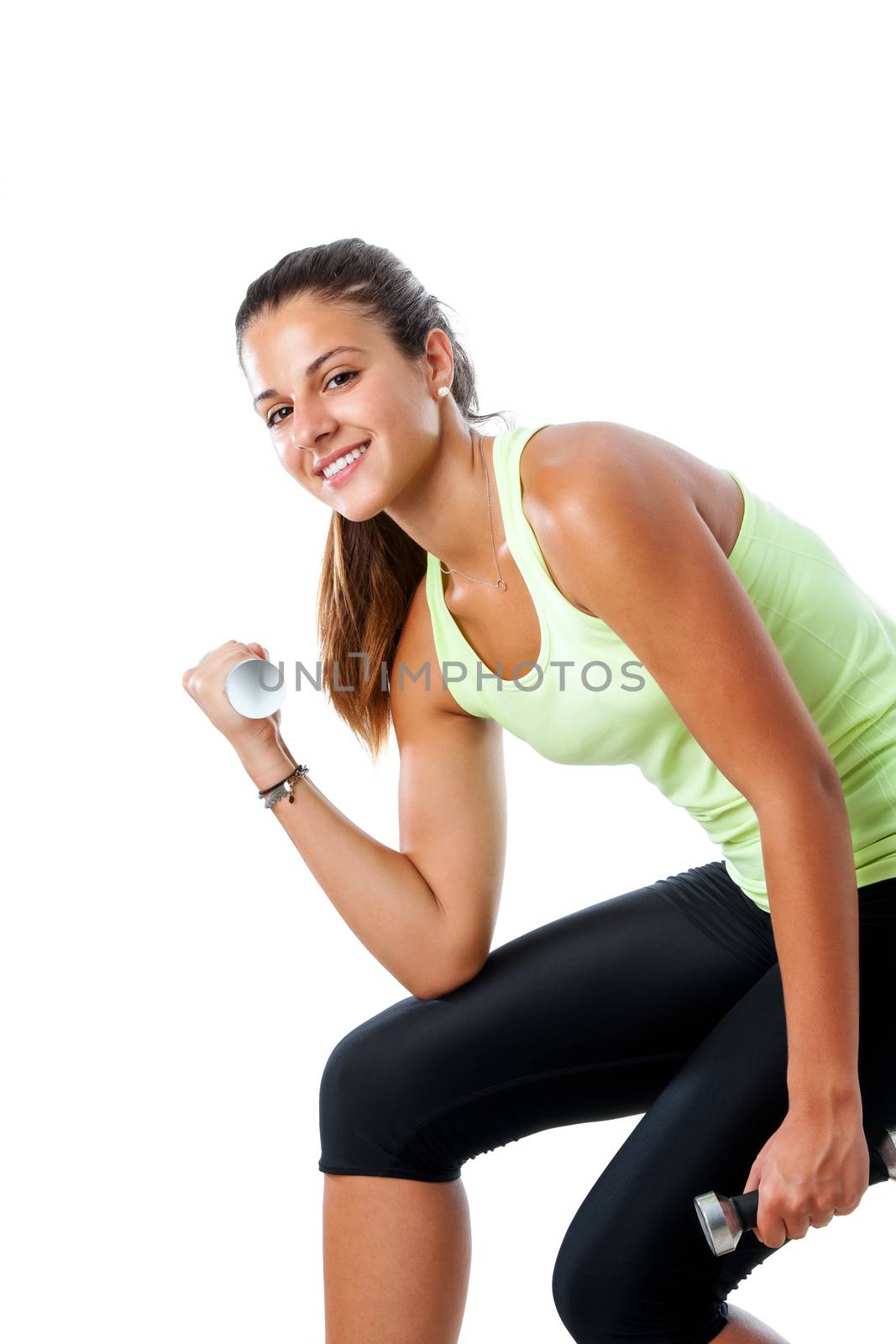 Close up portrait of attractive young girl doing muscle exercise with dumbbells.Isolated on white background.