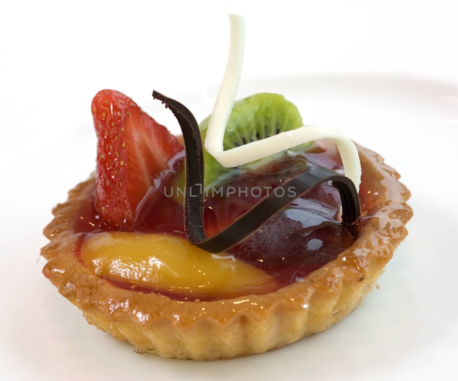 Mini fruit cake with fresh berries. Close up view.