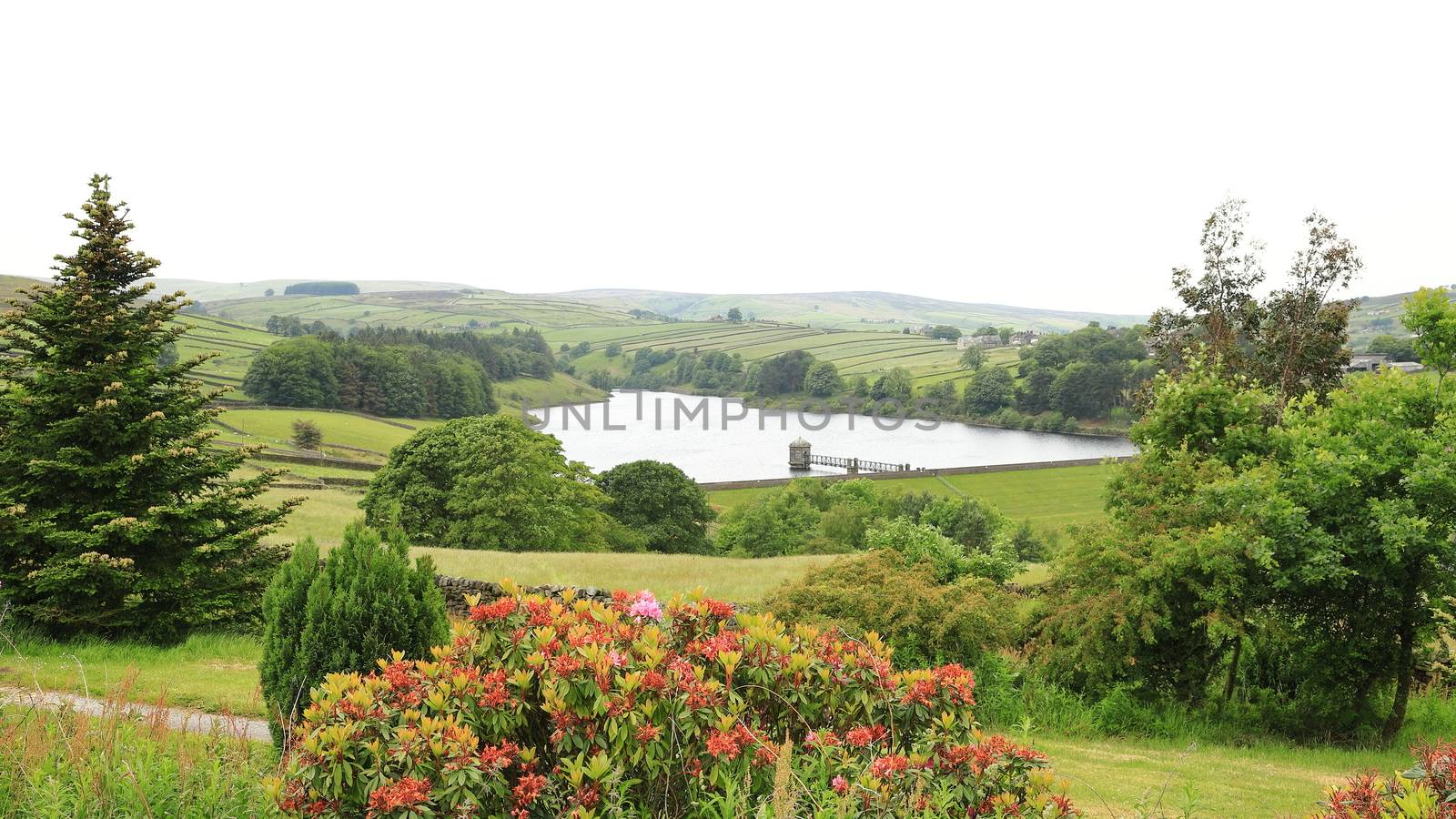 A view across the West Yorkshire countryside towards Lower Raithe Reservoir.  The reservoir is a short distance from the village of Haworth in northern England.