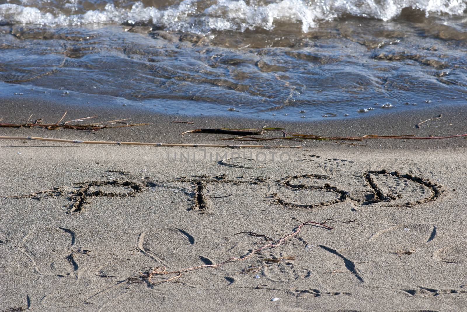 ptsd text on a beach sand by nehru