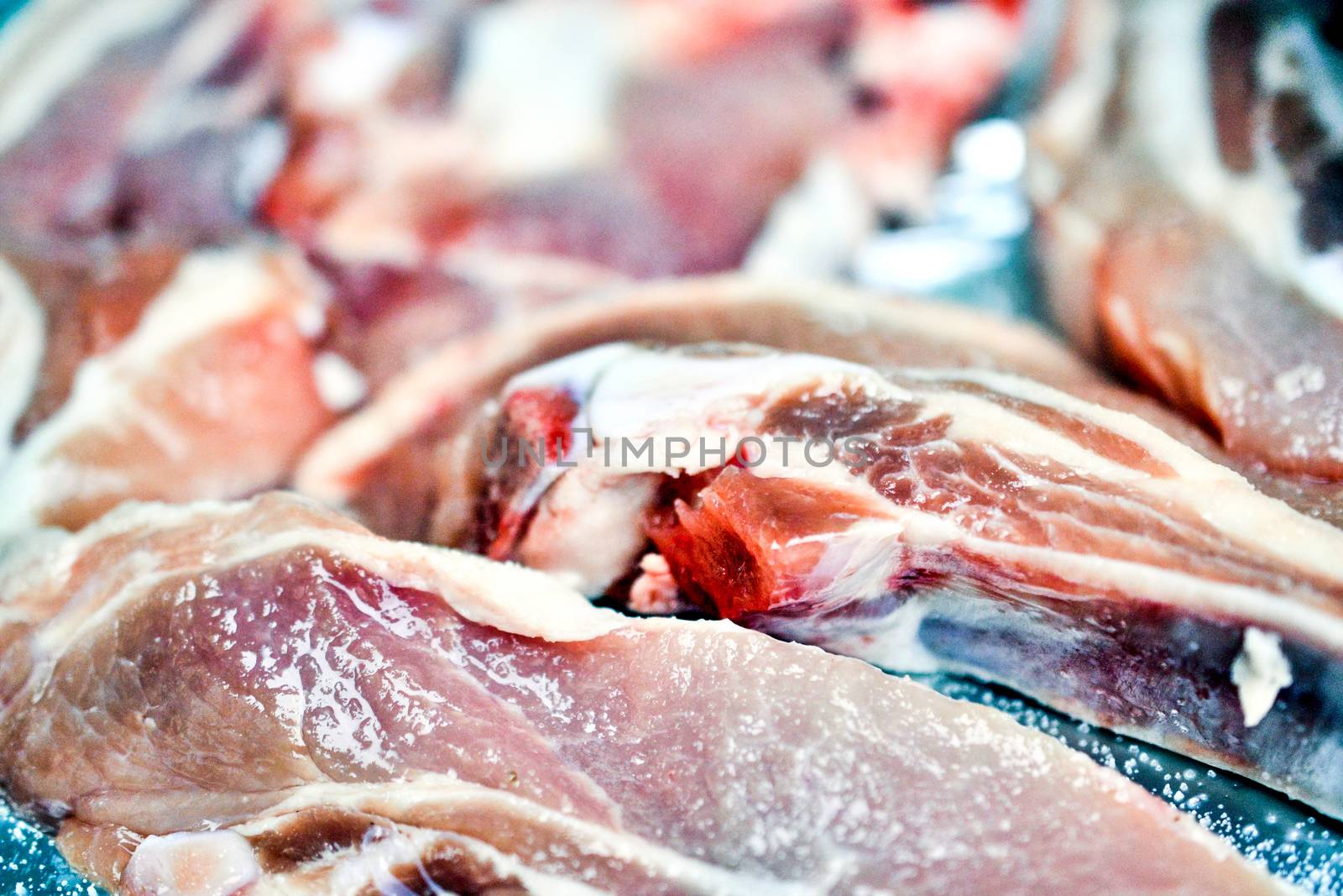 preparing meat for a coal barbeque image