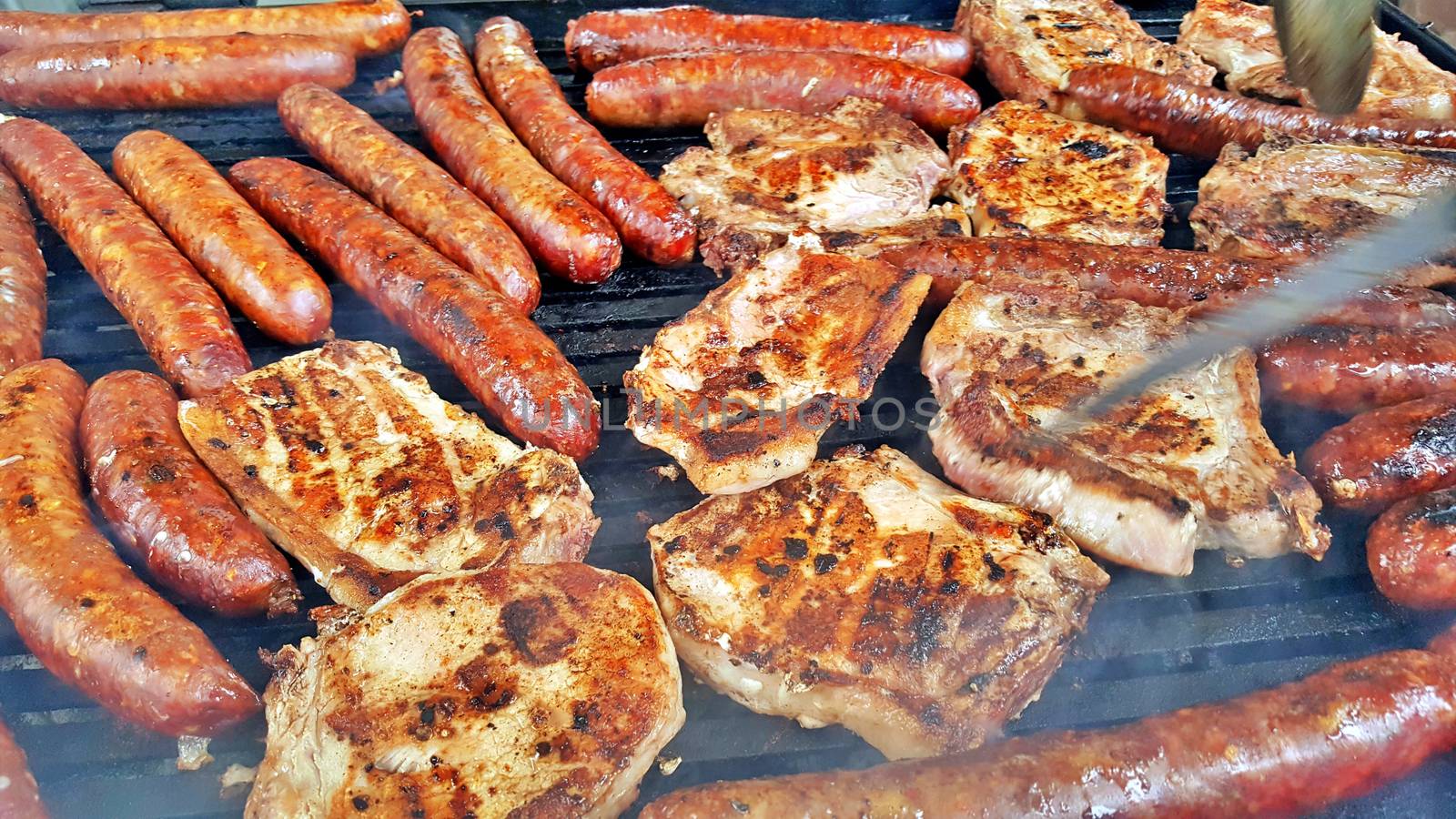 grilling meat meat on a coal barbeque image