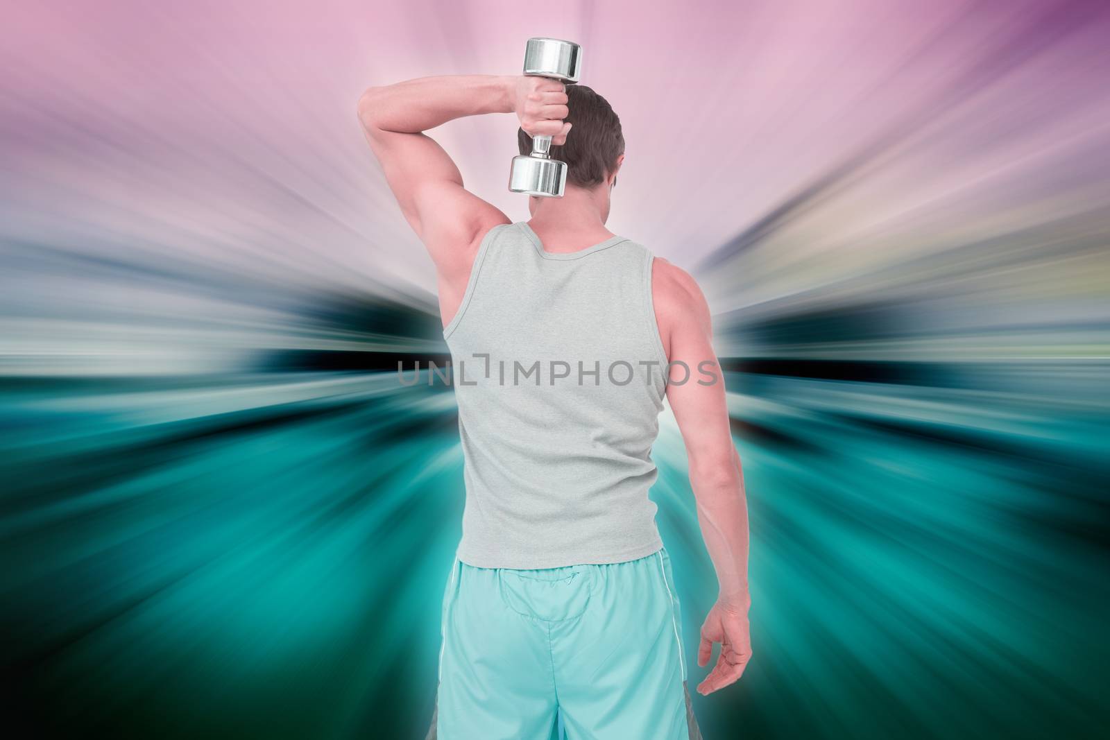 Rear view of a man exercising with dumbbell against abstract background