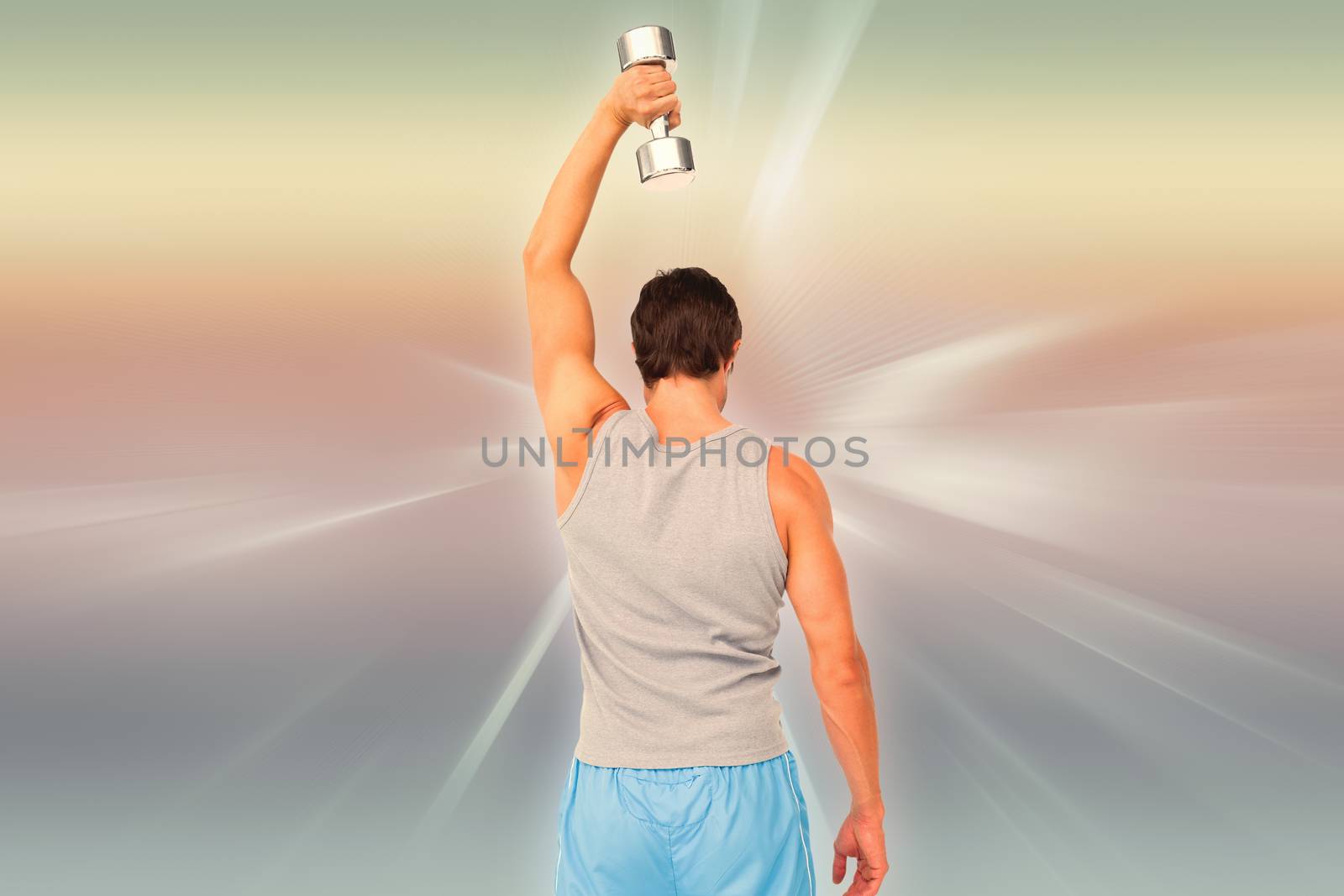 Composite image of rear view of a man exercising with dumbbell by Wavebreakmedia