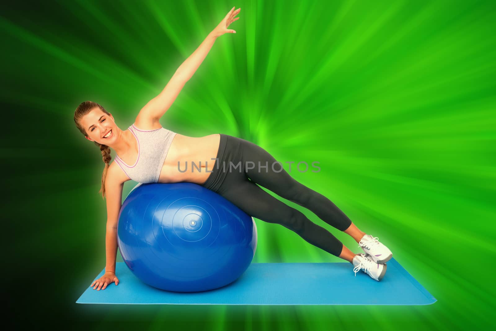 Composite image of portrait of a fit woman stretching on fitness ball by Wavebreakmedia