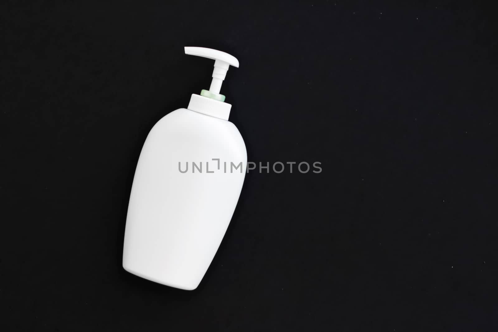 Blank label cosmetic container bottle as product mockup on black background, hygiene and healthcare