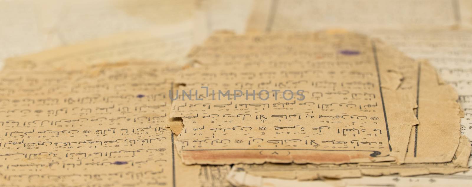 ancient old sheets of paper from the Arabic book, the Koran