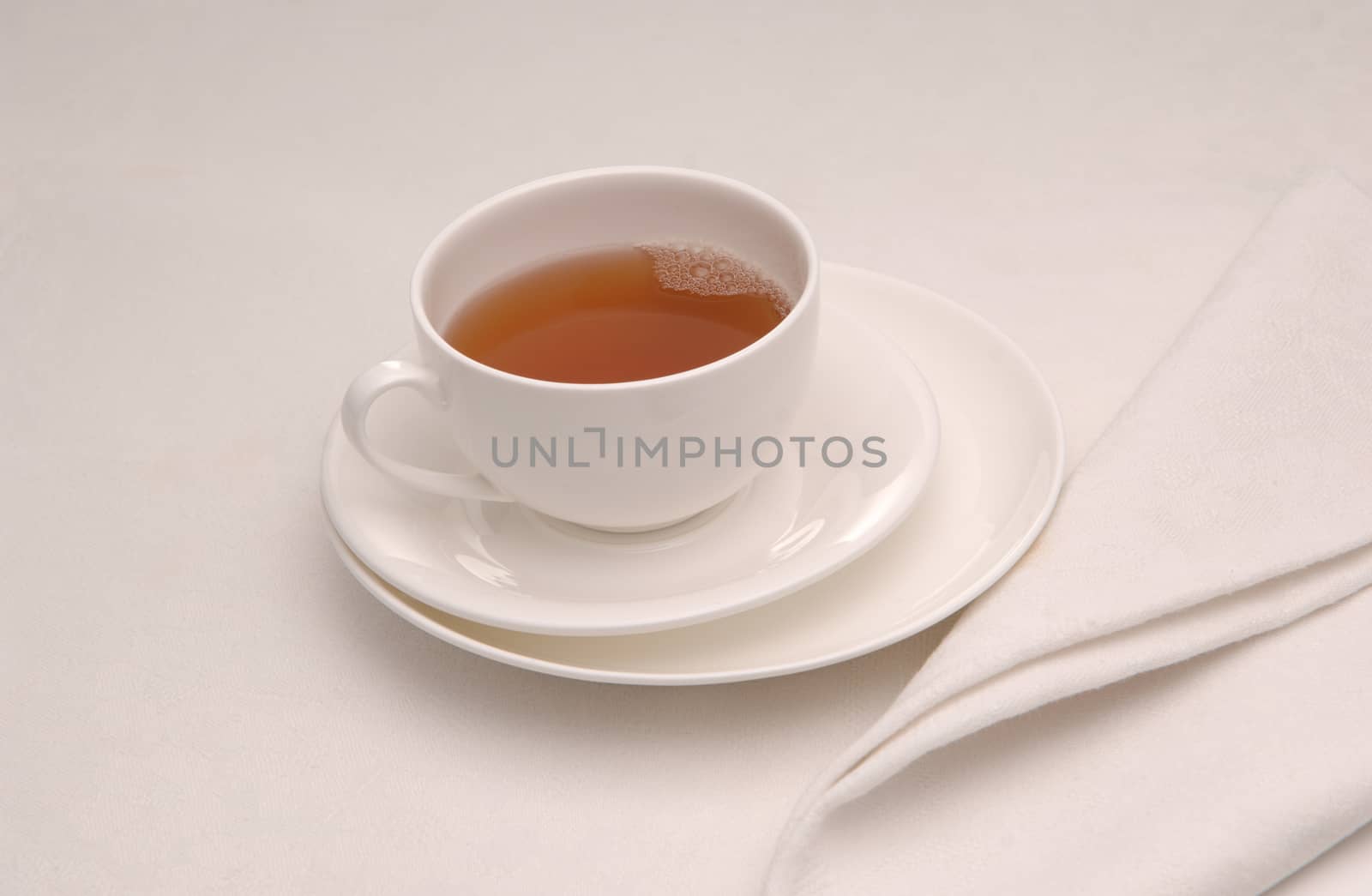 on white napkin with a cup of tea tea on the saucer