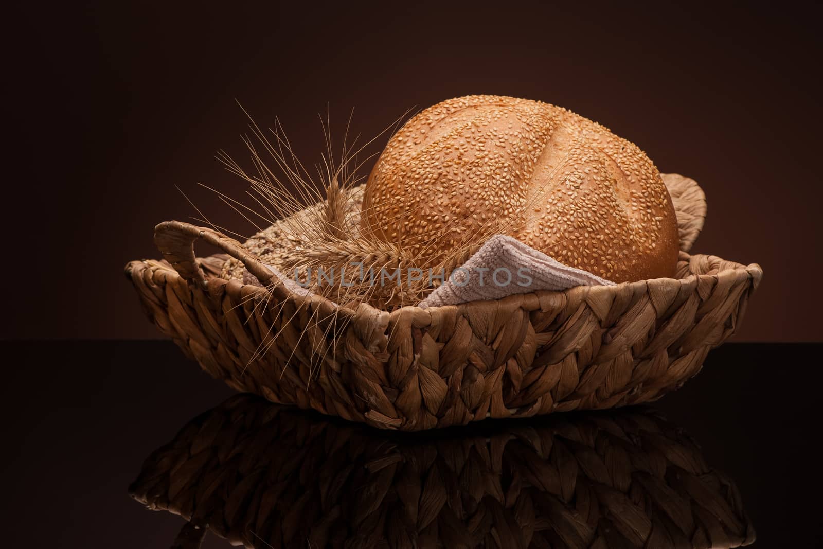 bread in a wicker basket on a dark background
