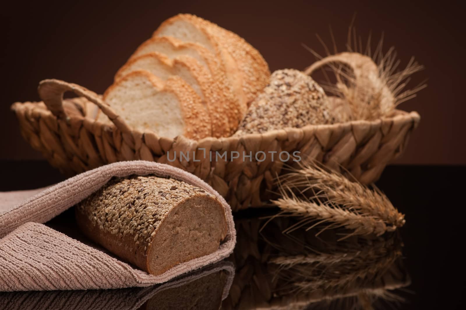 bread in a wicker basket on a dark background