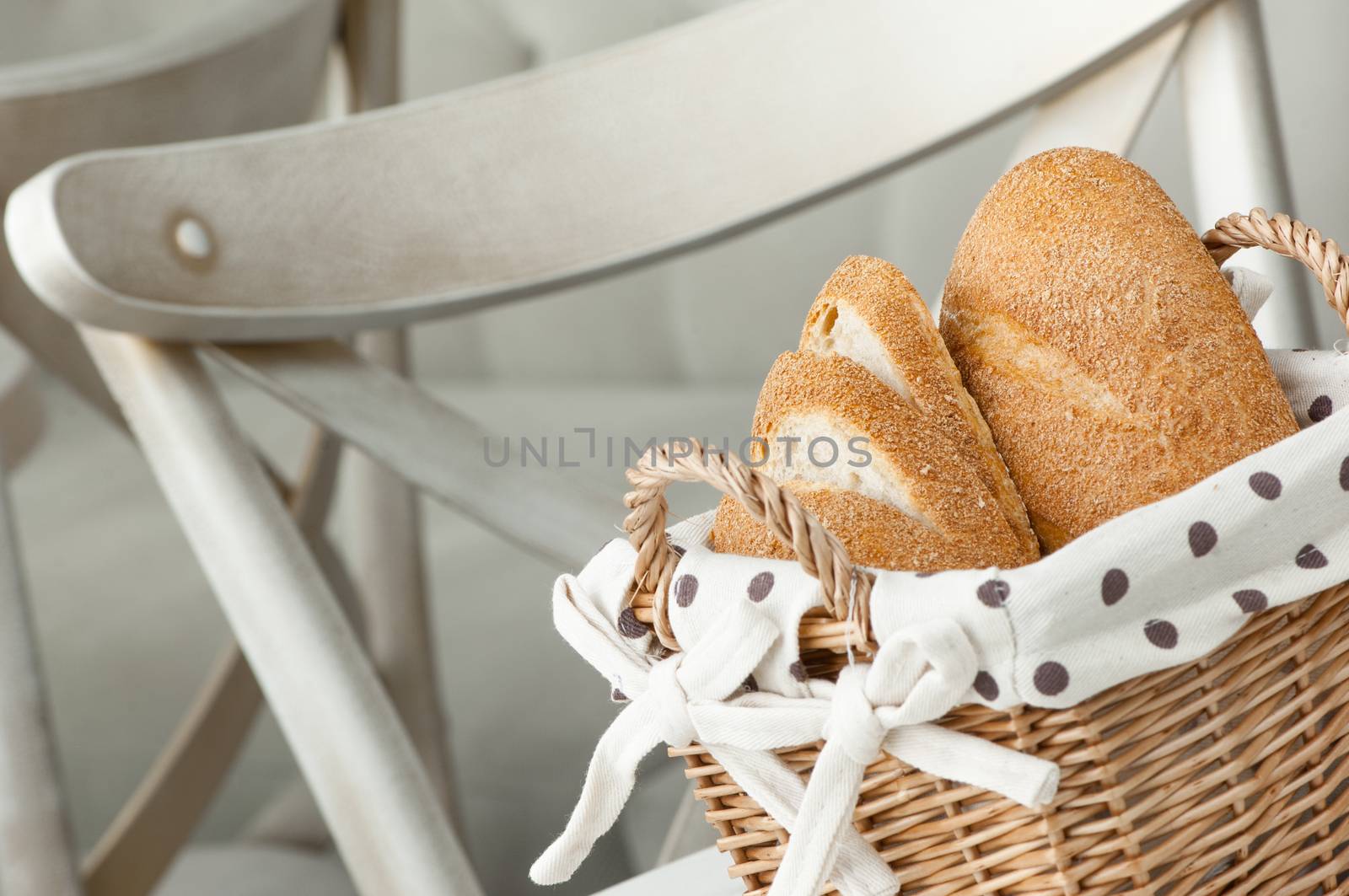 bread in a wicker basket on a light background on a table