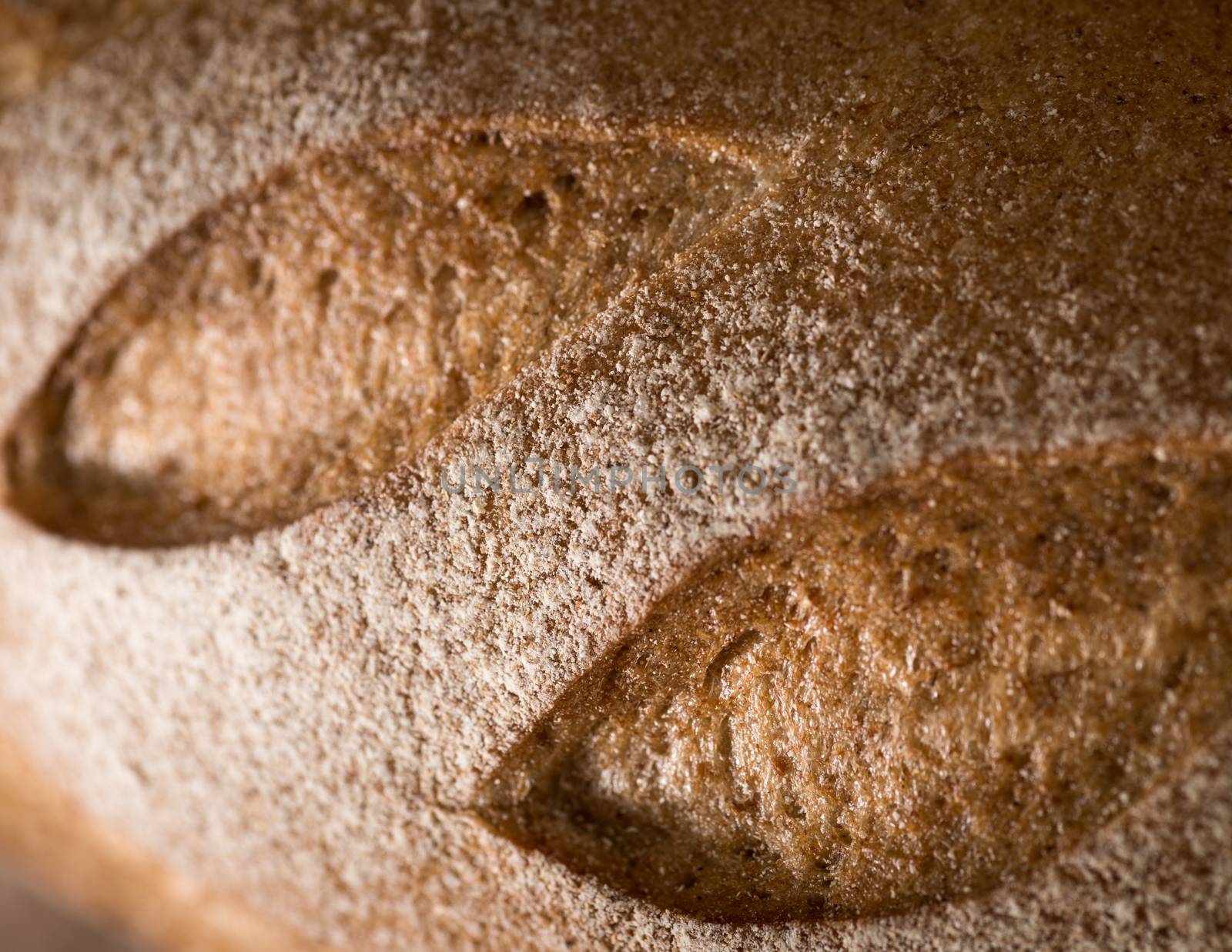 closeup of Golden and loaf of fresh bread