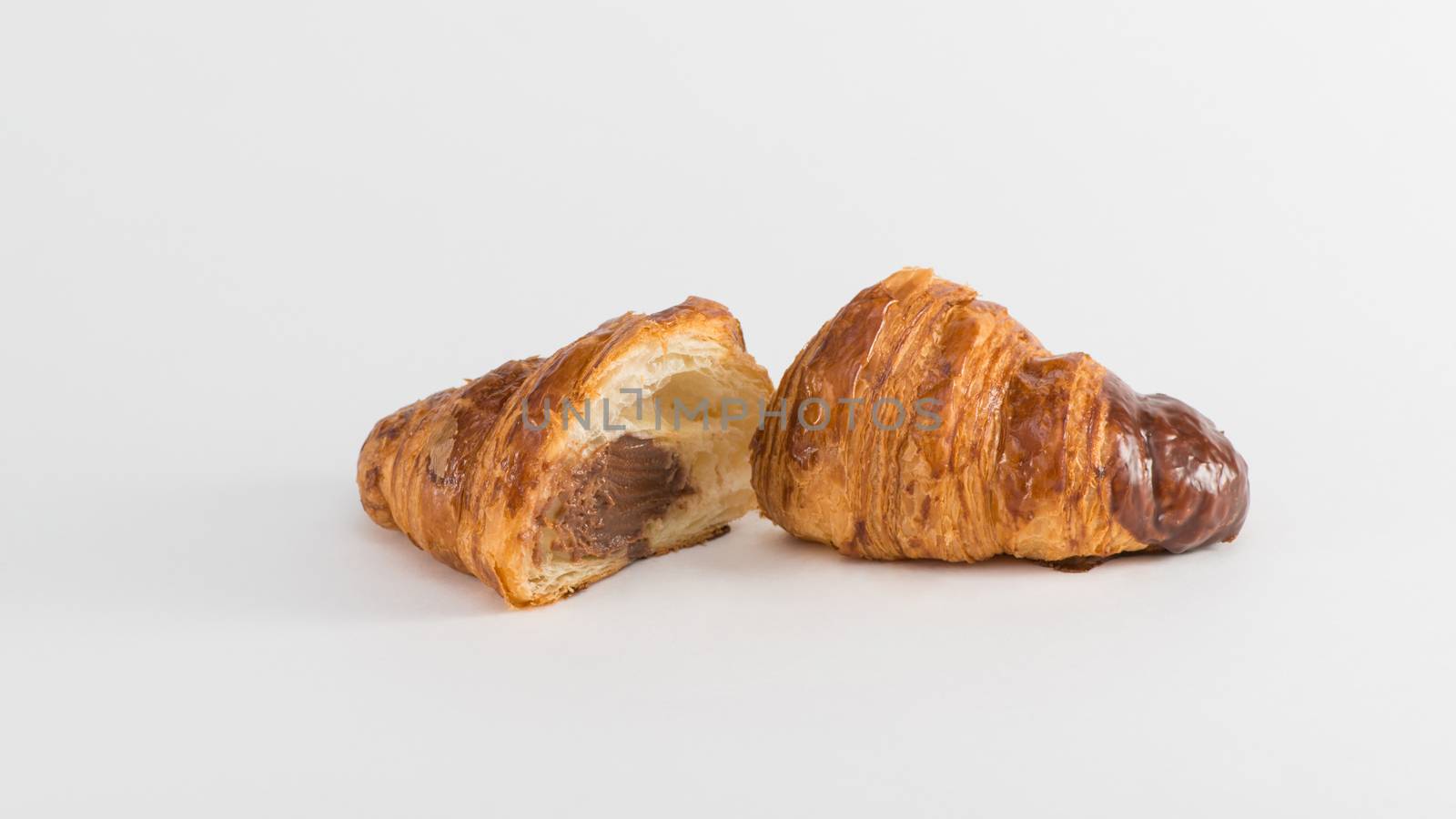 croissant with chocolate filling isolated on white background