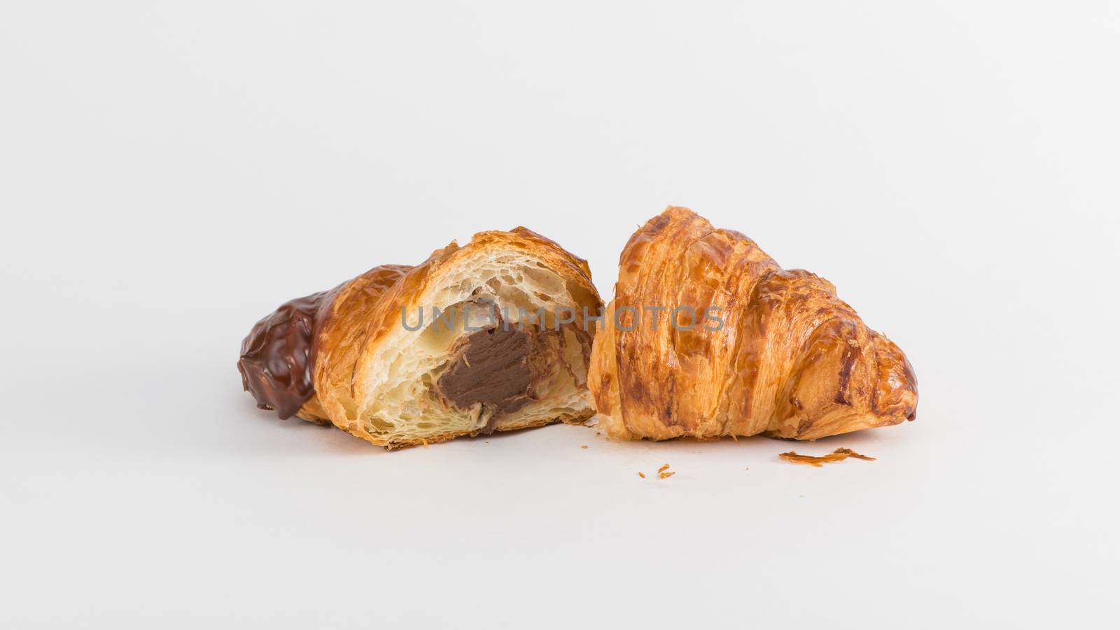 croissant with chocolate filling isolated on white background