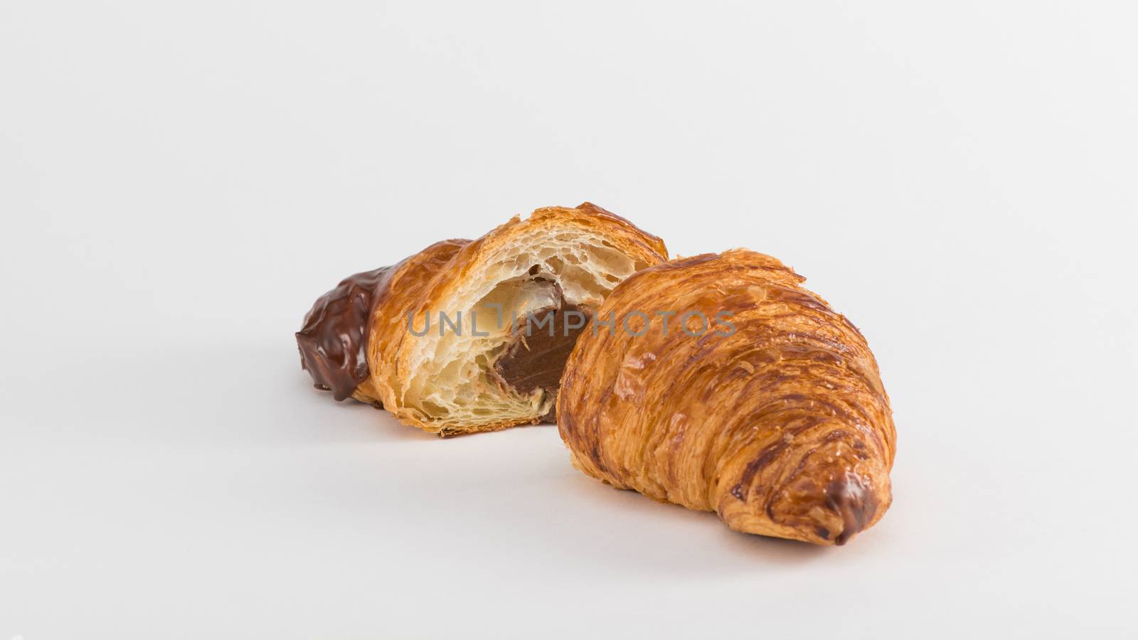 croissant with chocolate filling isolated on white background