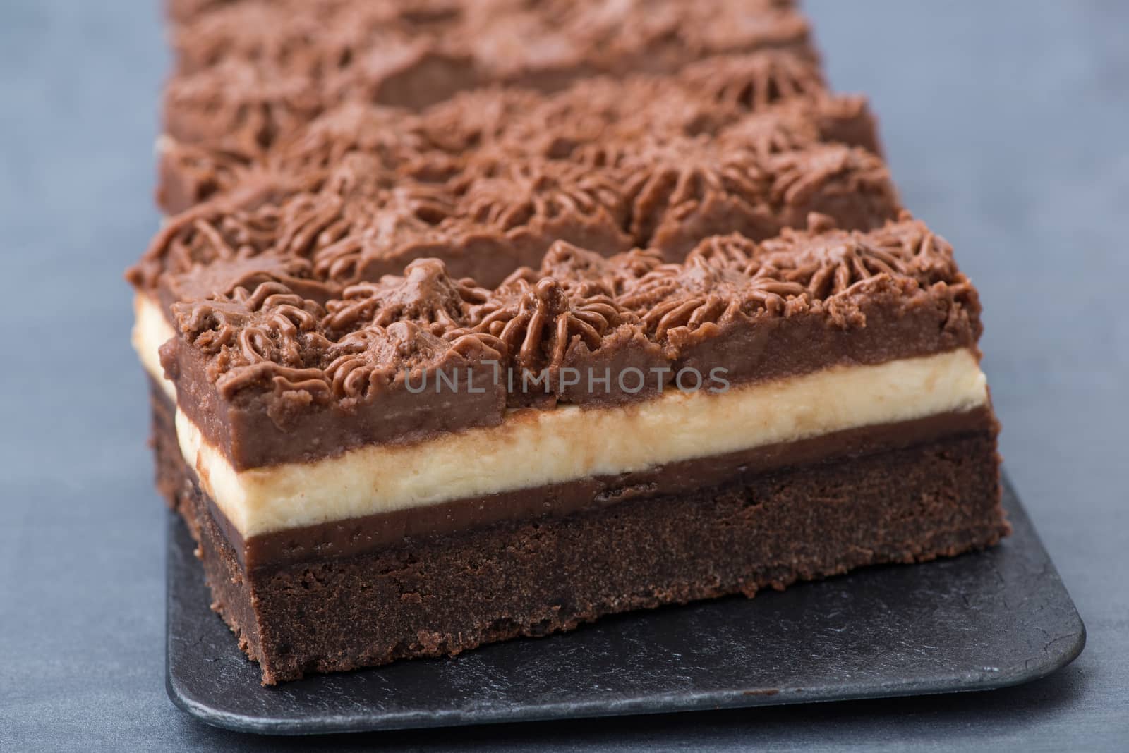 appetizing cake on a black plate