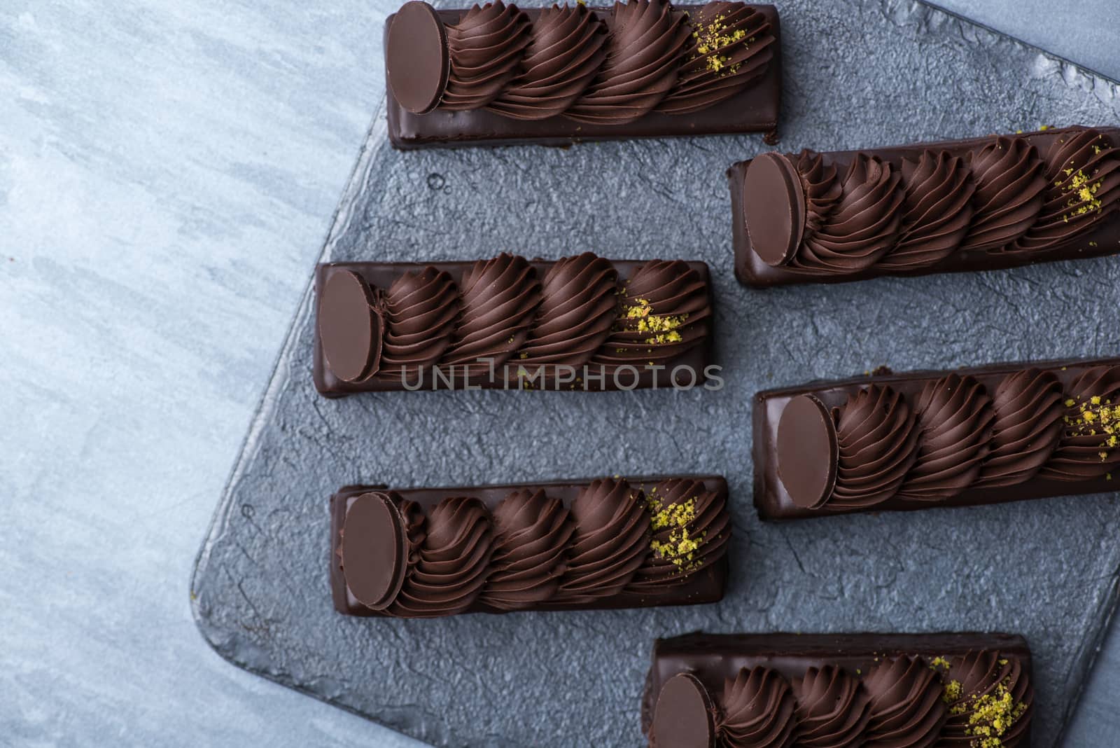 appetizing cake on a black plate, top view