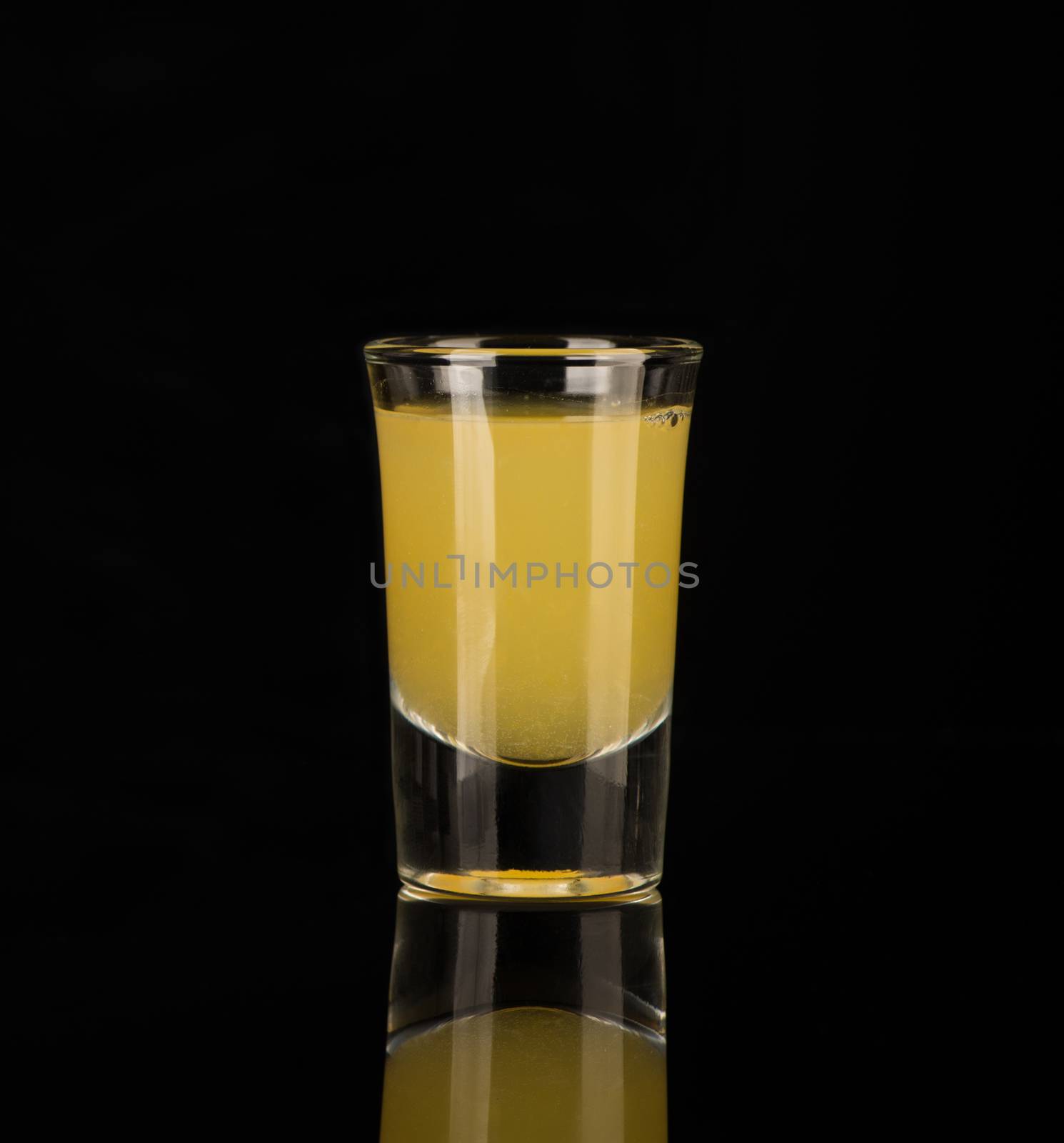 shot glass with alcohol on a dark background by A_Karim