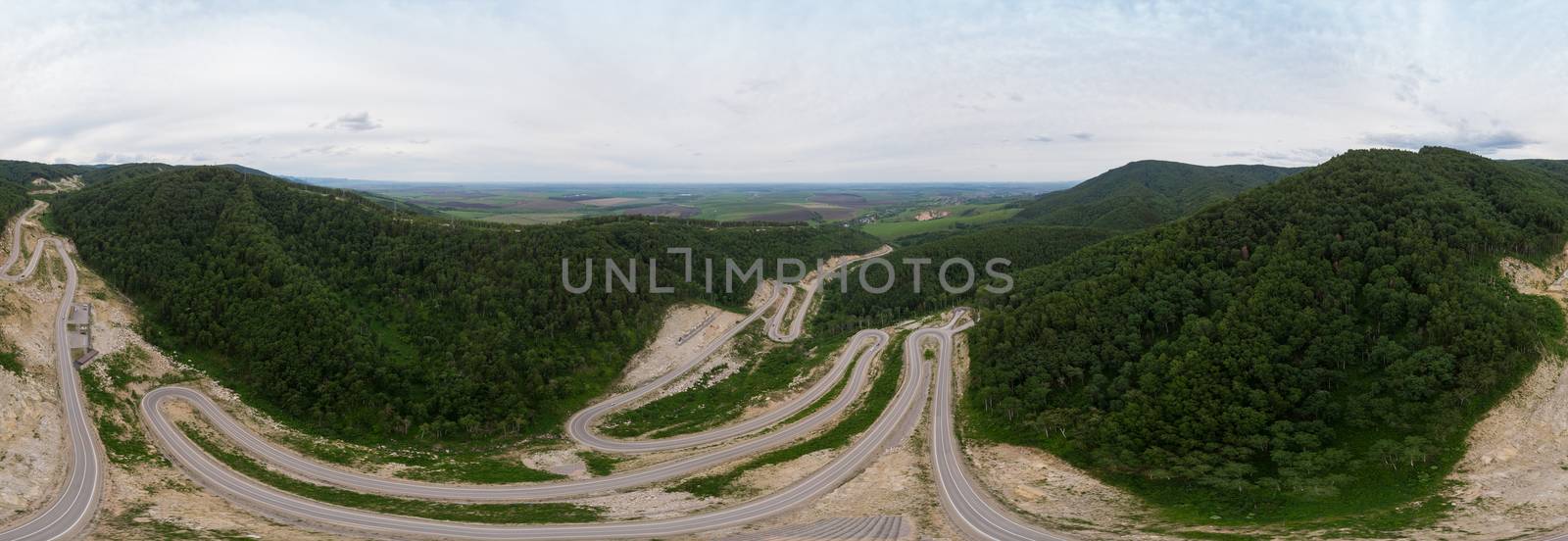 Full 360 equirectangular spherical panorama of aerial top vew of winding road in the mountains, drone shot. Altai Krai, Western Siberia, Russia. Road to Resort town Belokurikha 2. Virtual reality content