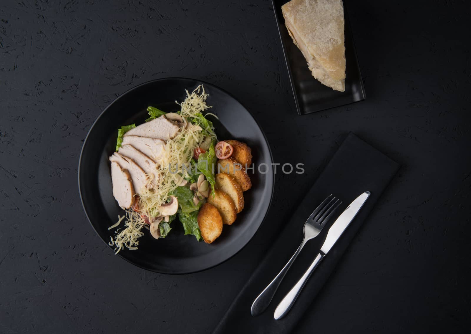 a meat dish on a black surface by A_Karim