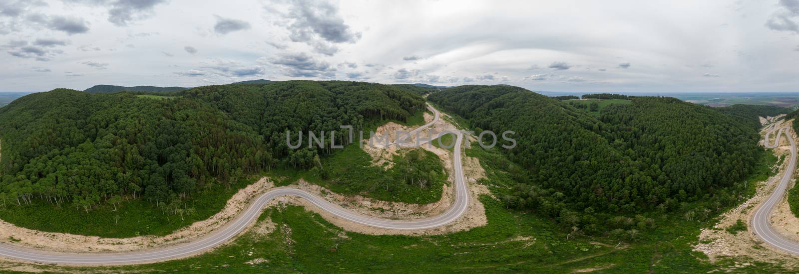 Full 360 equirectangular spherical panorama of aerial top vew of winding road in the mountains, drone shot. Altai Krai, Western Siberia, Russia. Road to Resort town Belokurikha 2. Virtual reality content