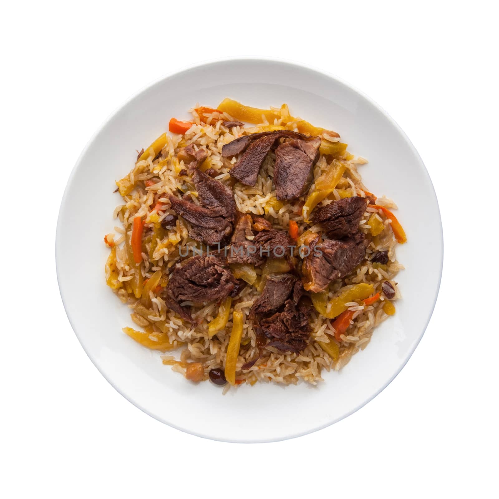 traditional pilaf with meat in a plate on a white background. Top view. Isolated