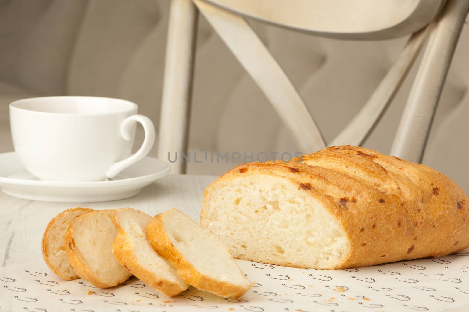 bread and a cup on the table by A_Karim