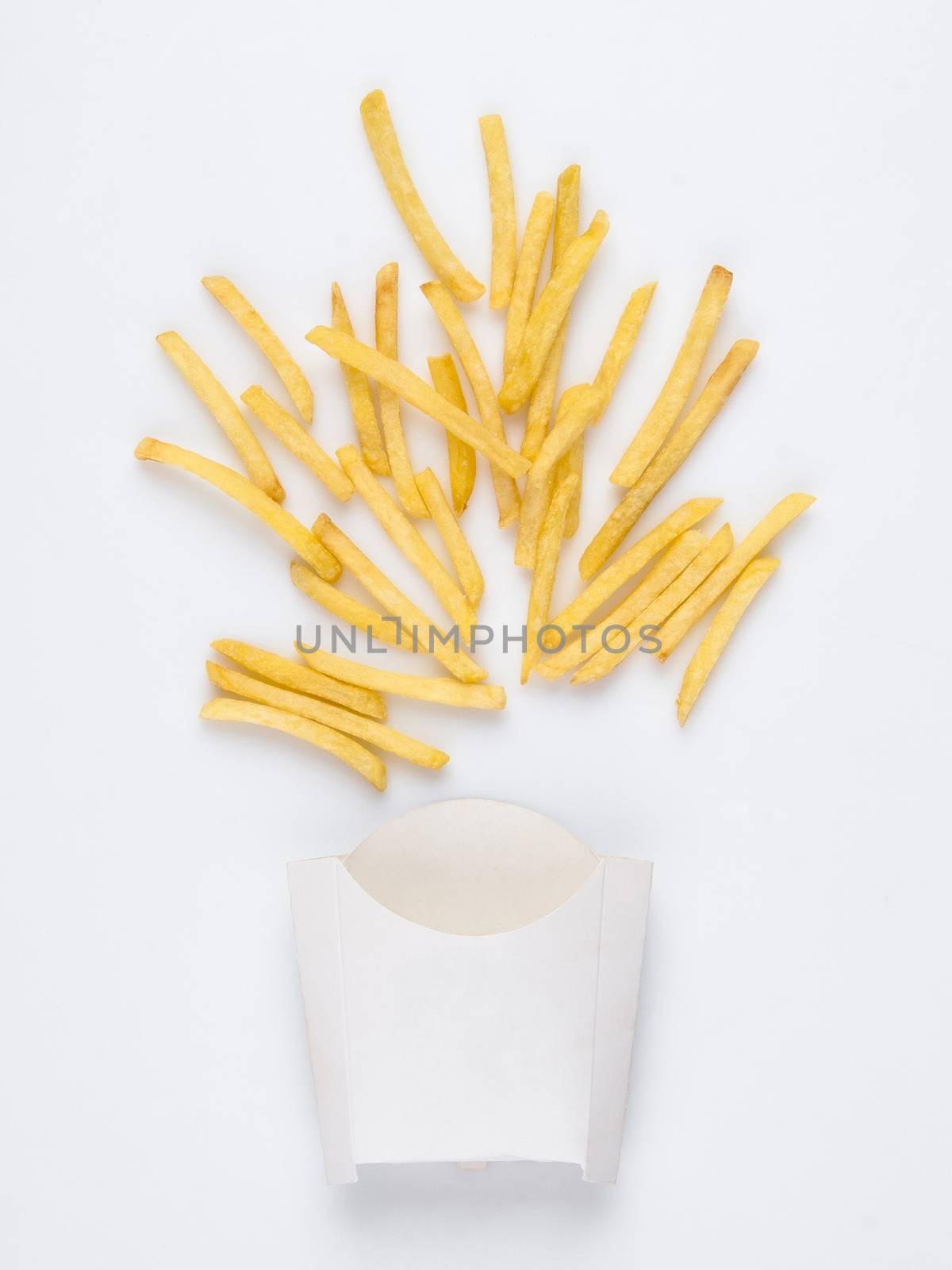 on a white background fried french fries in a white box. studio photo of fried french fries on white background