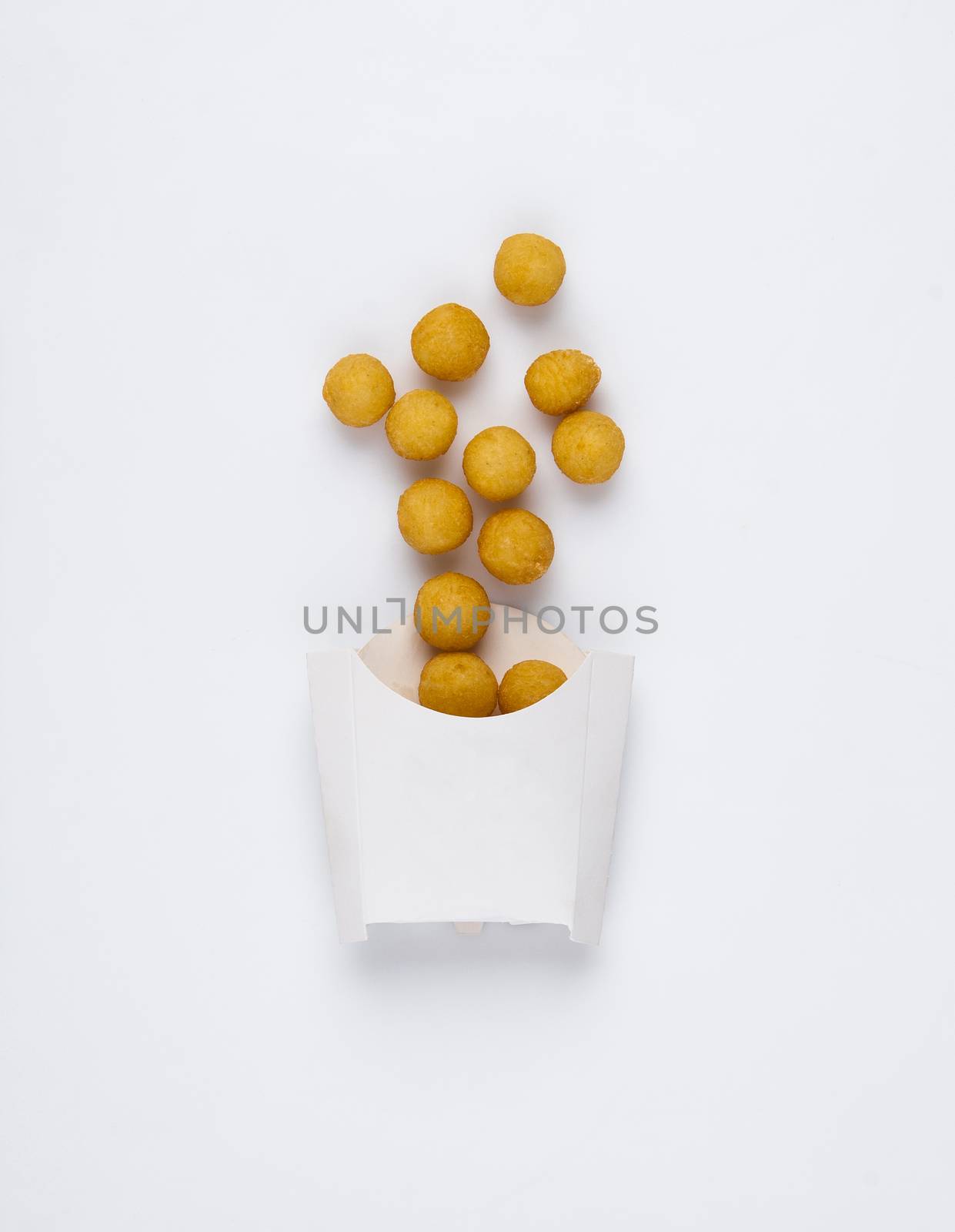 fried chicken balls in a white box on a white background. studio picture of fried chicken balls