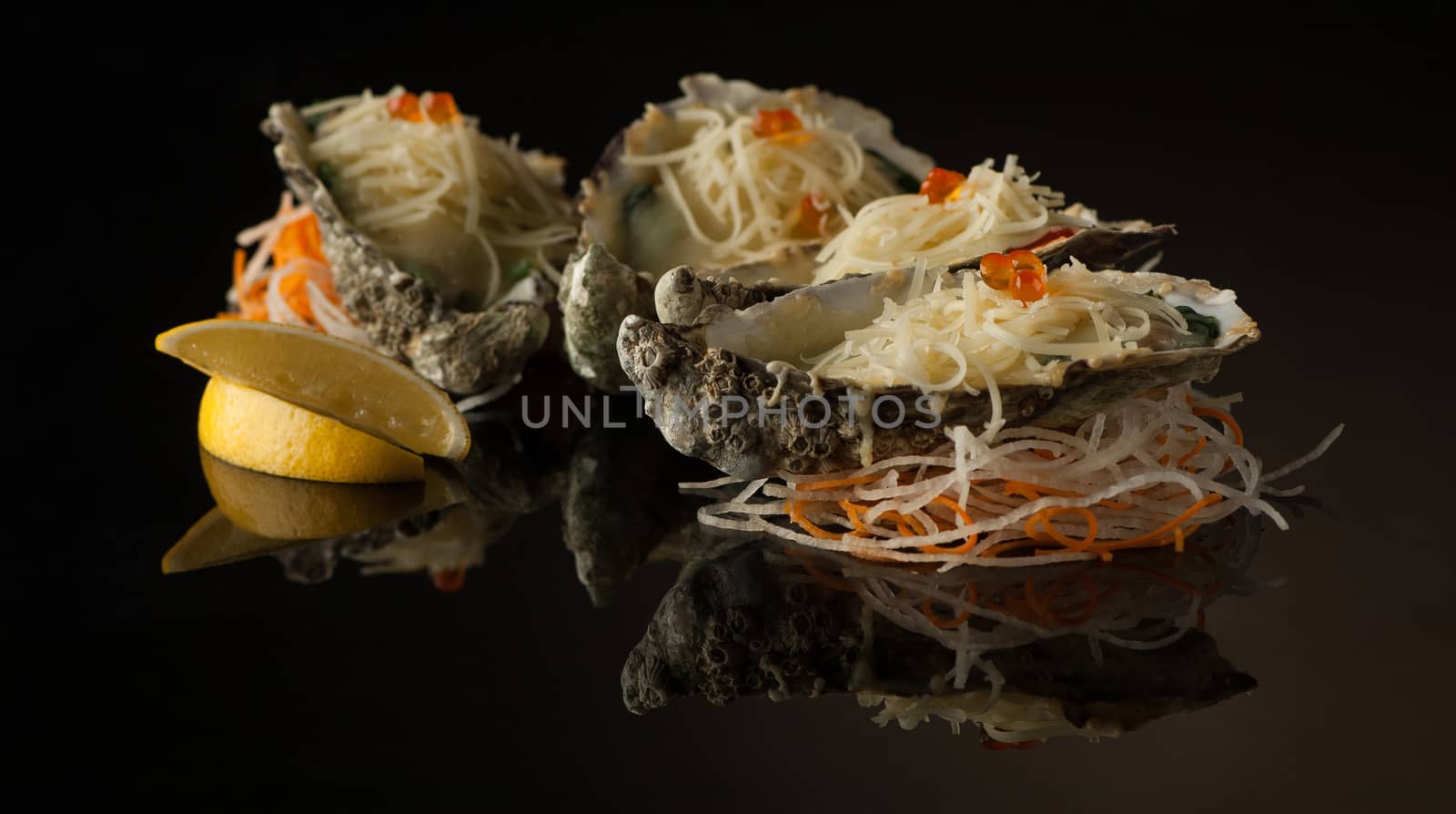 seafood and mussels in a shell with melted cheese and lemon slices on a black background with reflection. mussels in a shell with salad on a dark background