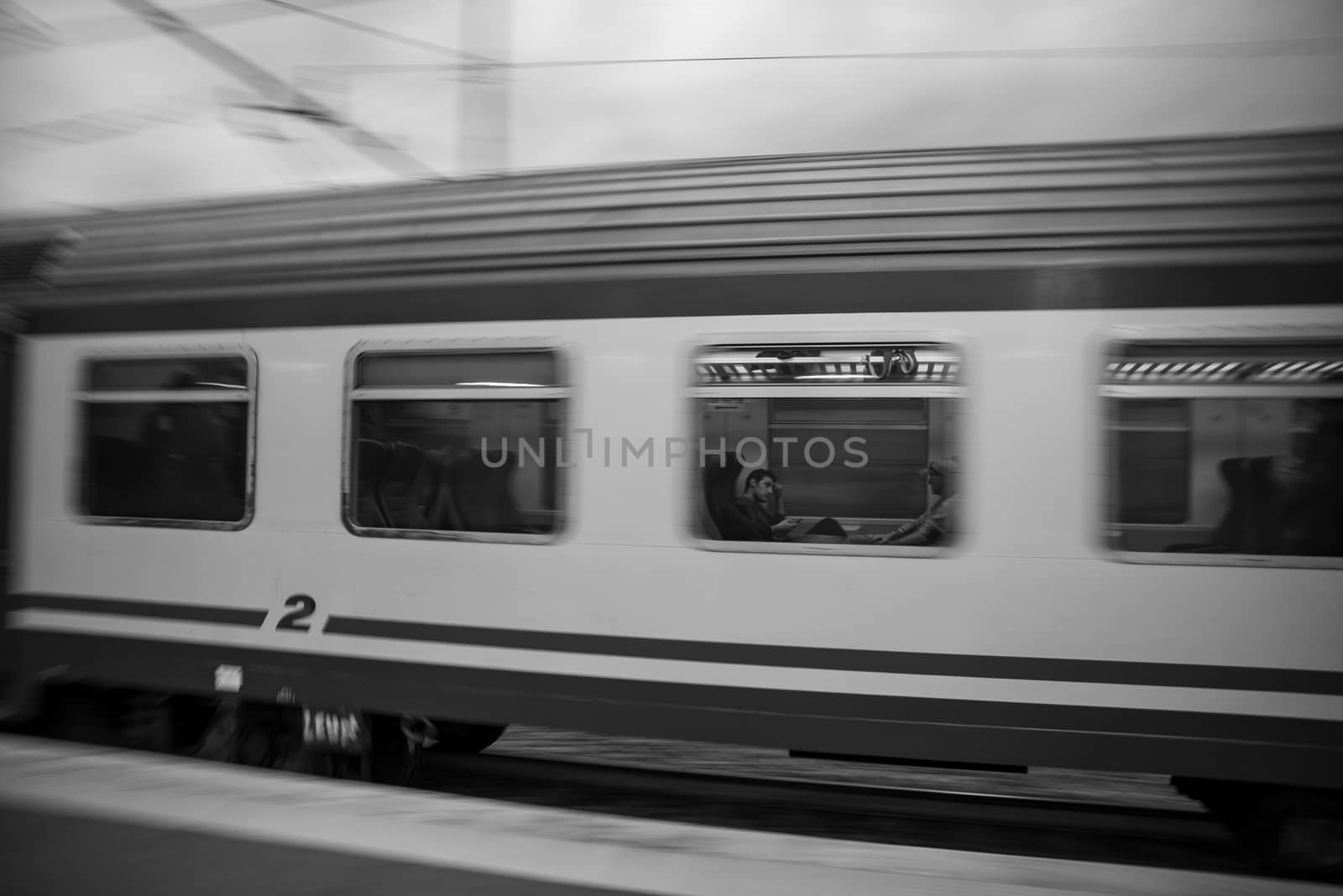 teni,italy may 28 2020 :panning trains at the station in speed with people inside