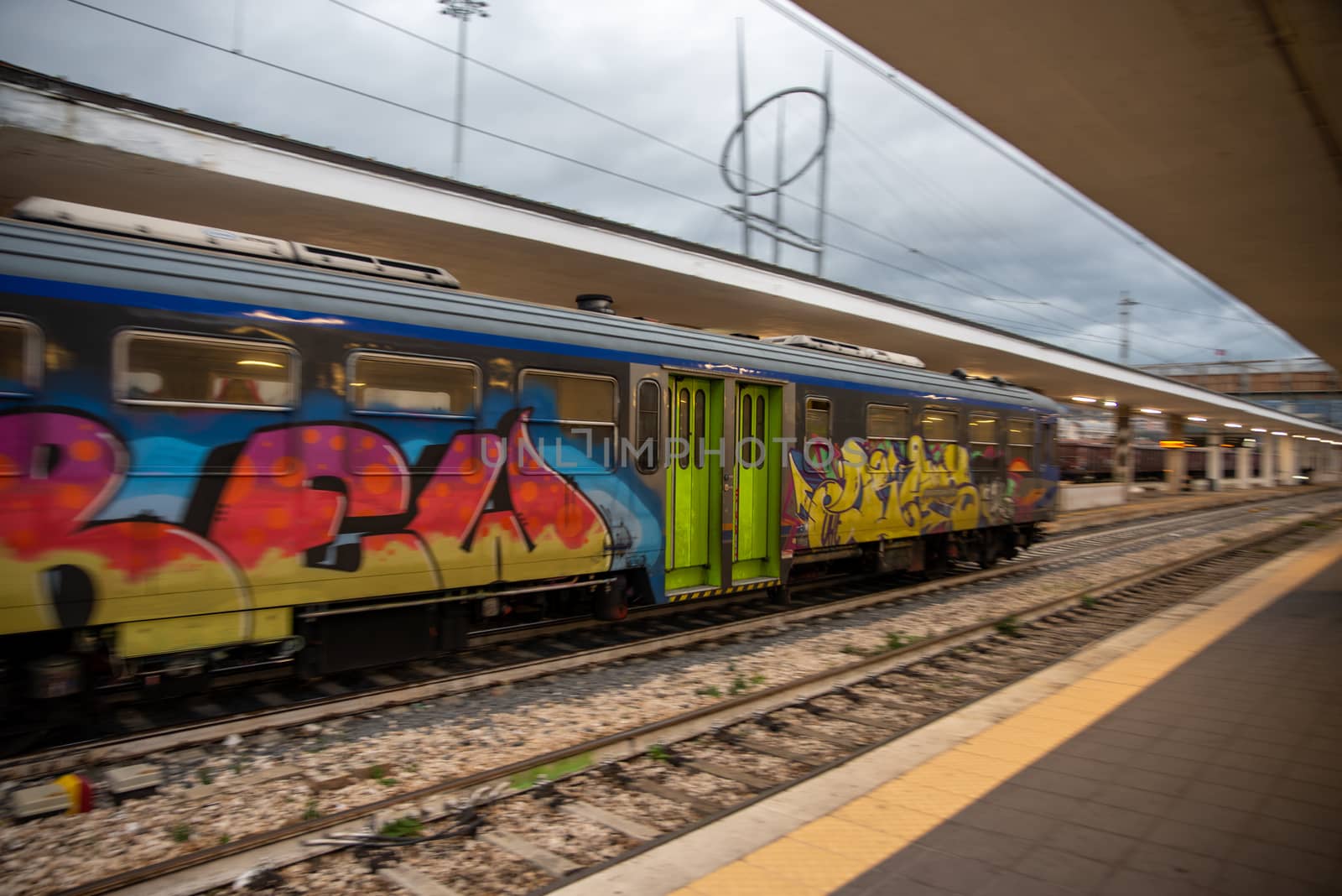 colorful trains at the station in speed by carfedeph