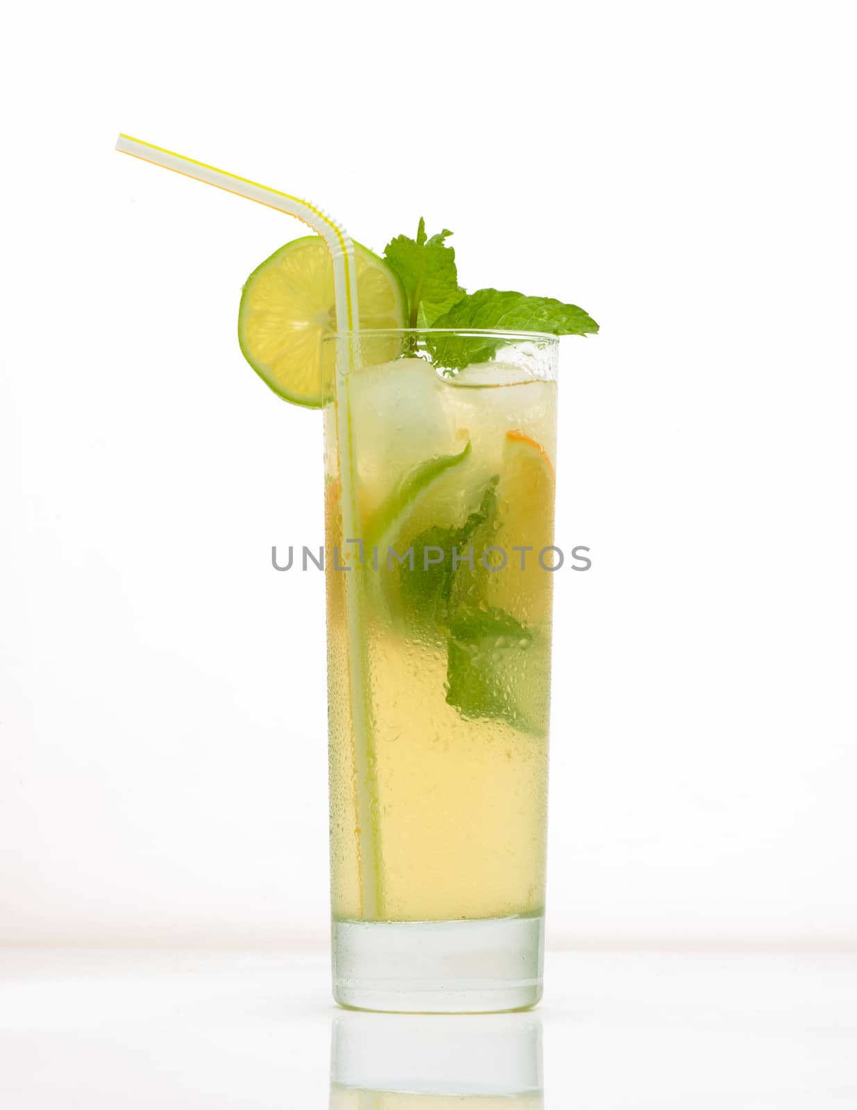 lemon drink in a glass with ice and straw. drink isolated on white background