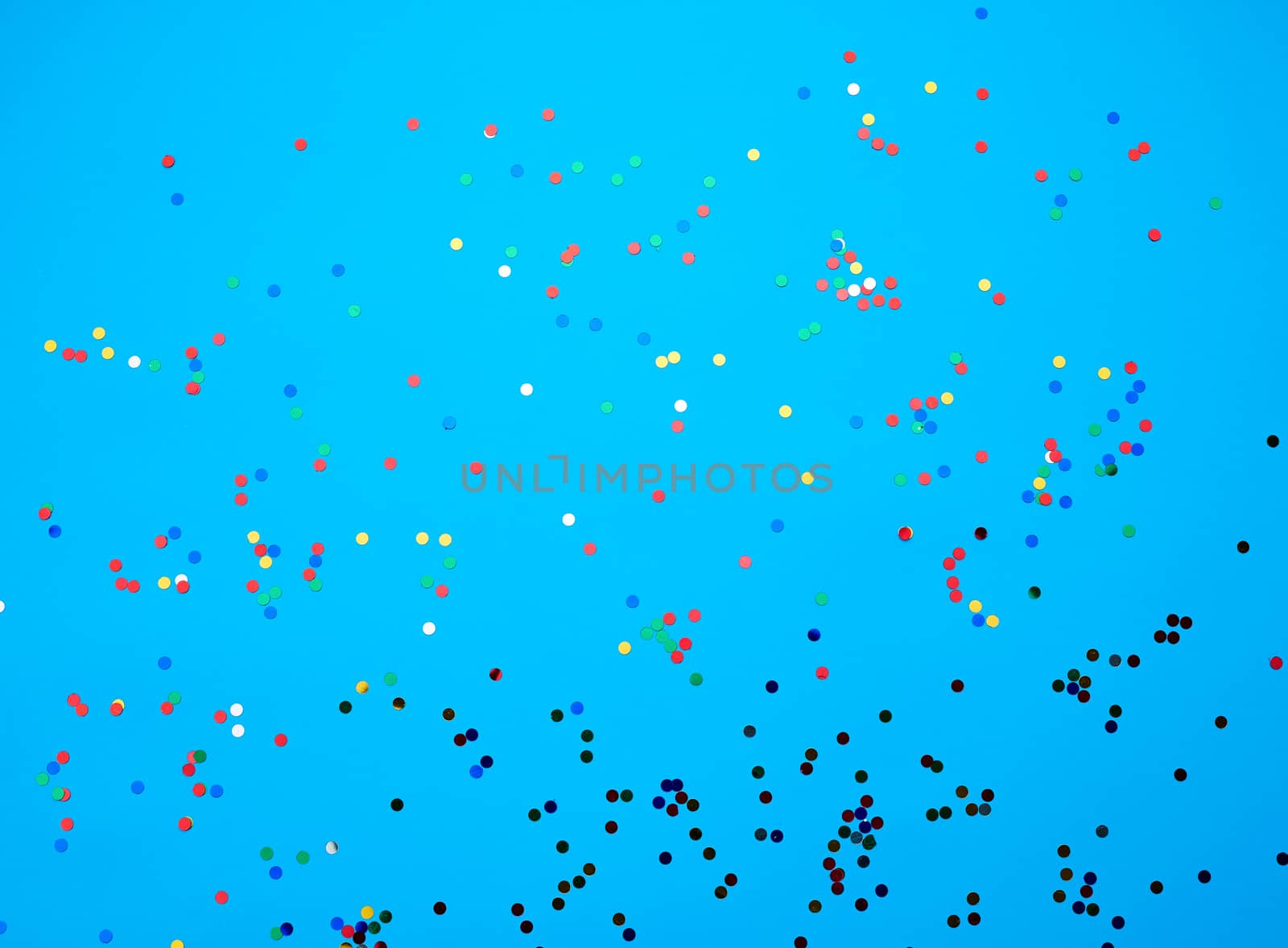 shiny multicolored round confetti scattered on a blue background, festive backdrop for birthday, valentines day. Festive decoration element. Flat design 