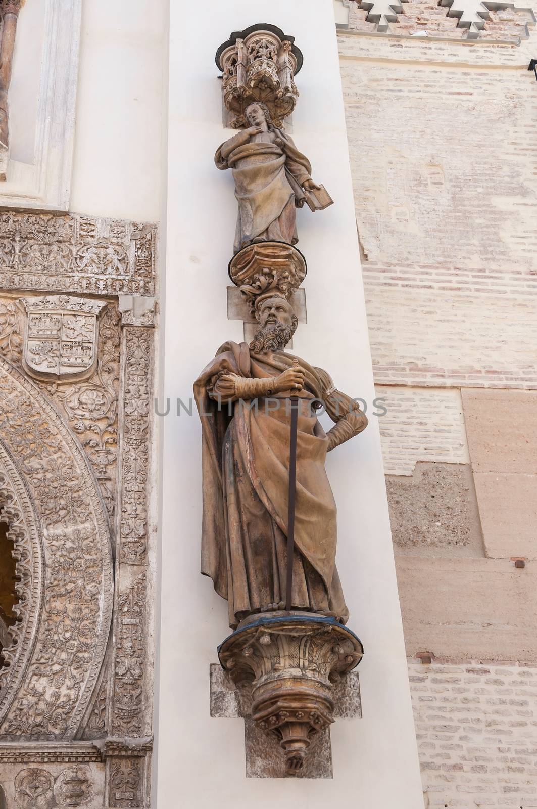 Statue of Saint Paul the Apostel by the Gate of Pardon of Seville Cathedral, Spain