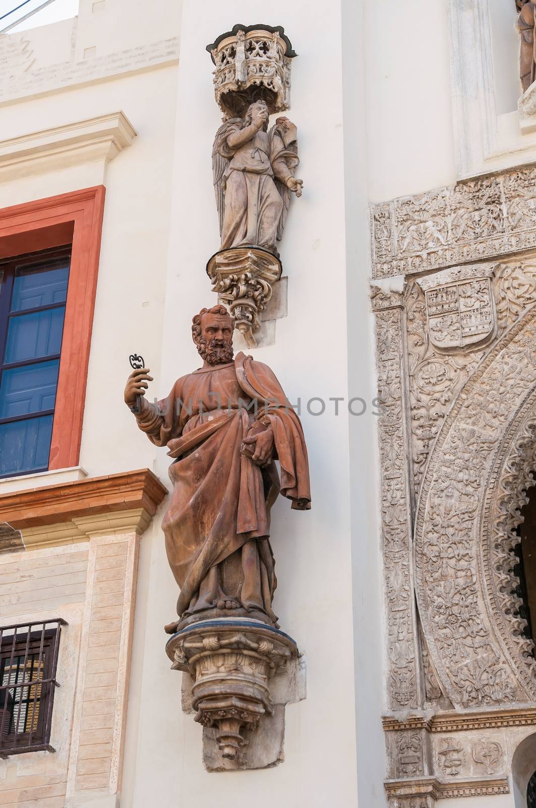 Statue of Saint Peter by the Gate of Pardon of Seville Cathedral, Spain