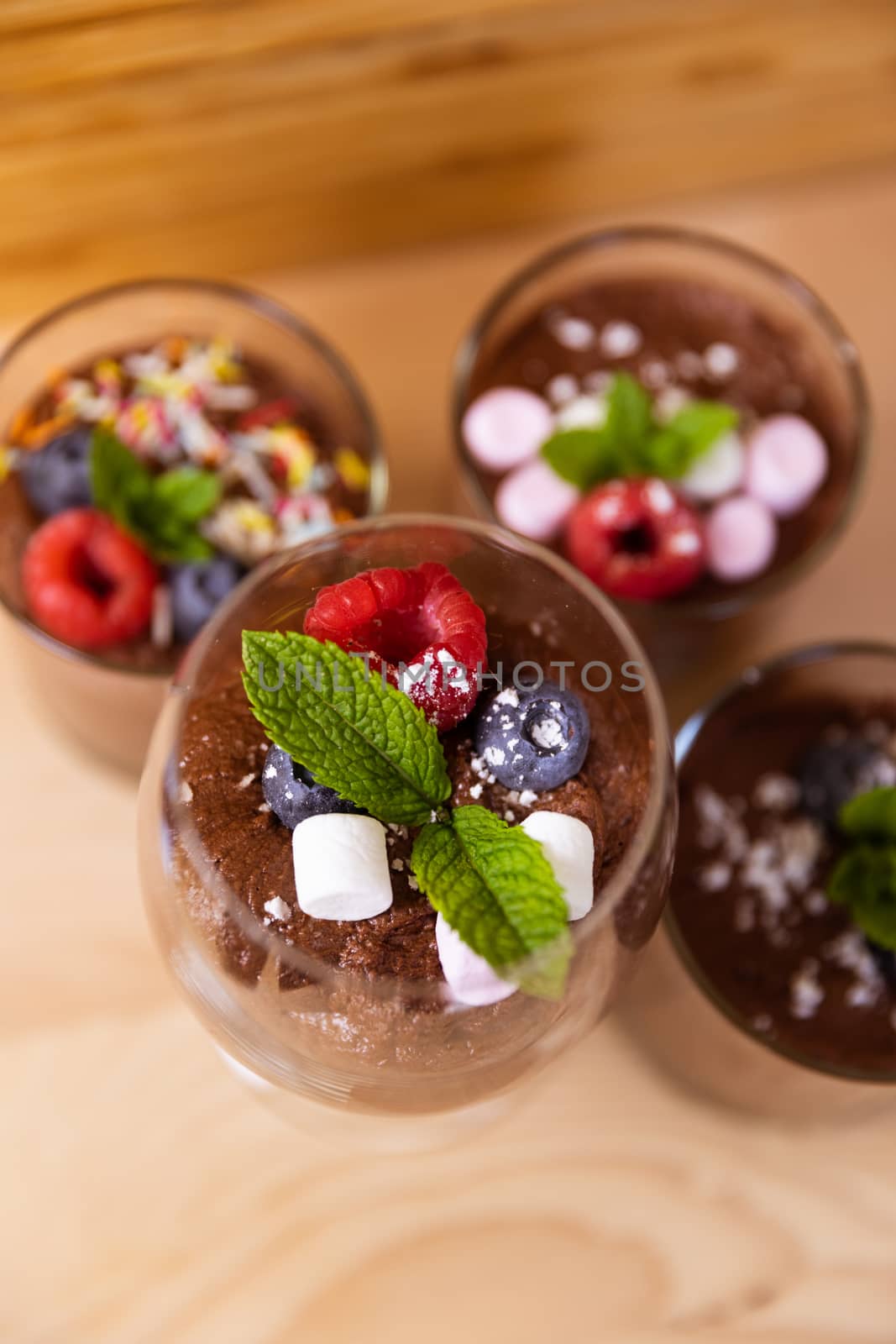 Group shot with glasses filled with chocolate mousse by camerarules