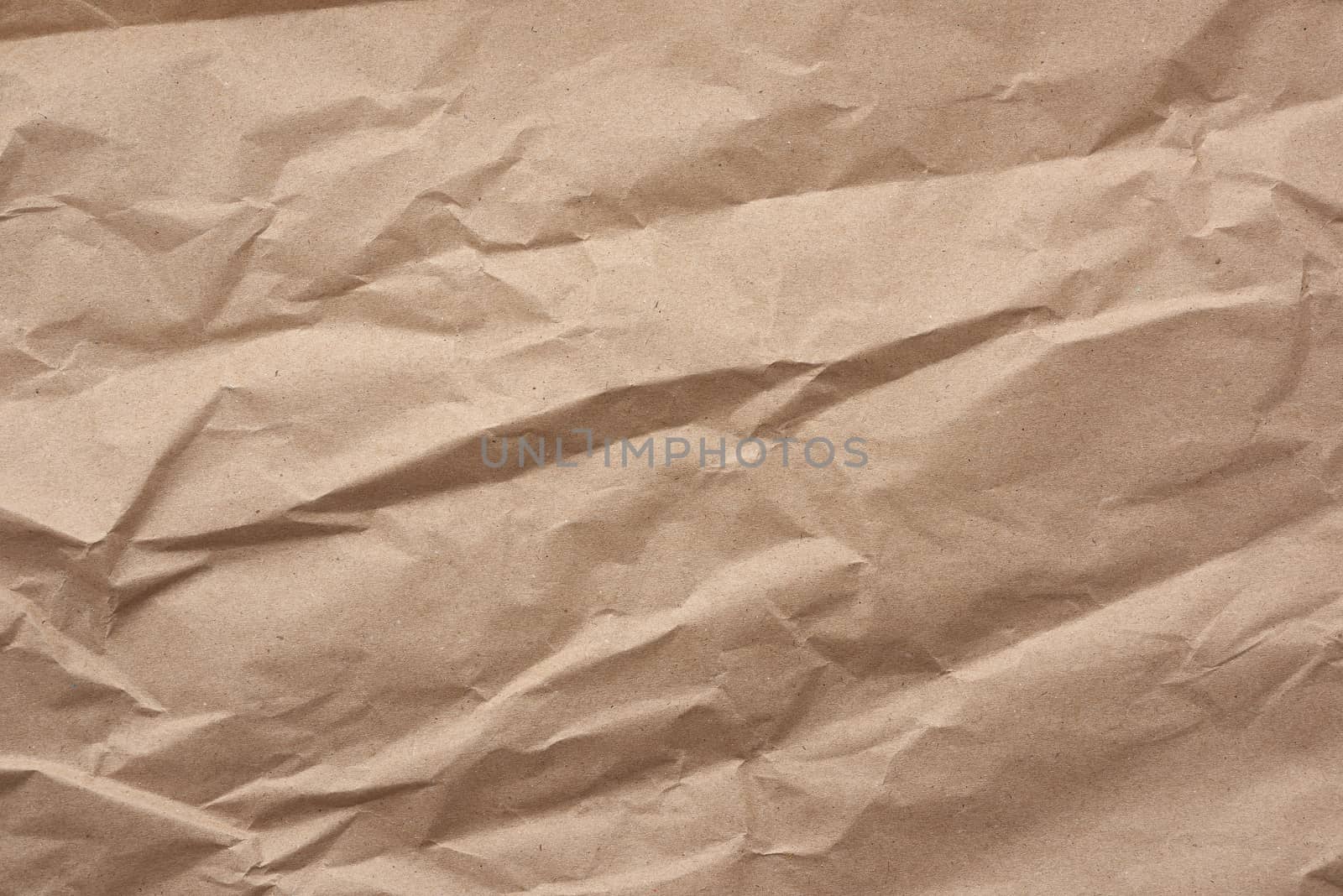 fragment of crumpled blank sheet of brown wrapping kraft paper, vintage texture for the designer, full frame