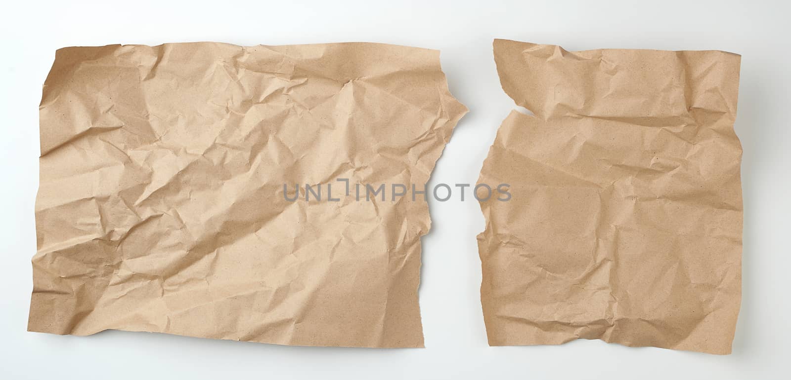 clean torn brown sheet of craft paper on a white background, template for designer