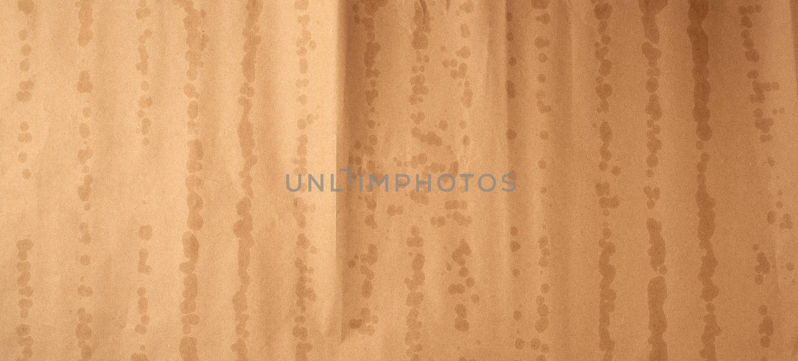texture of brown kraft paper with bold spots, full frame, template and blank for the designer