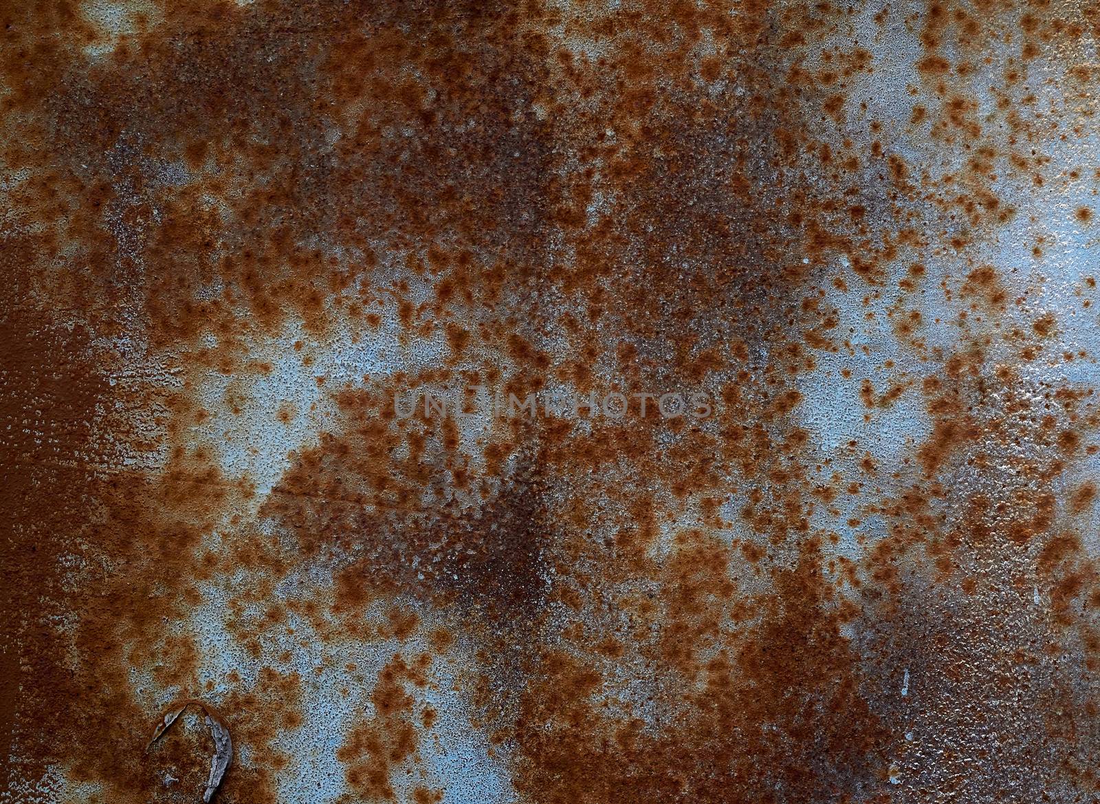 iron texture of rusty sheet with remains of blue paint. Metal rusty texture background rust steel.