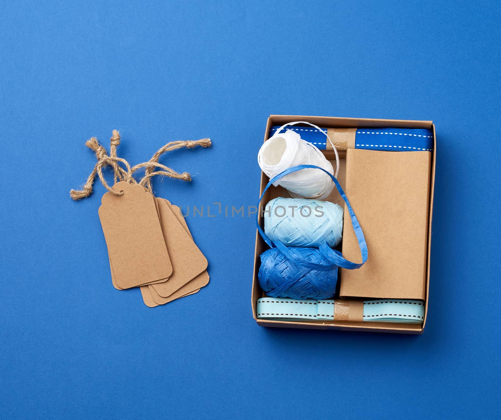 set for packing holiday gifts on a blue background, top view